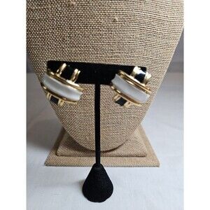 White and black clip on earrings